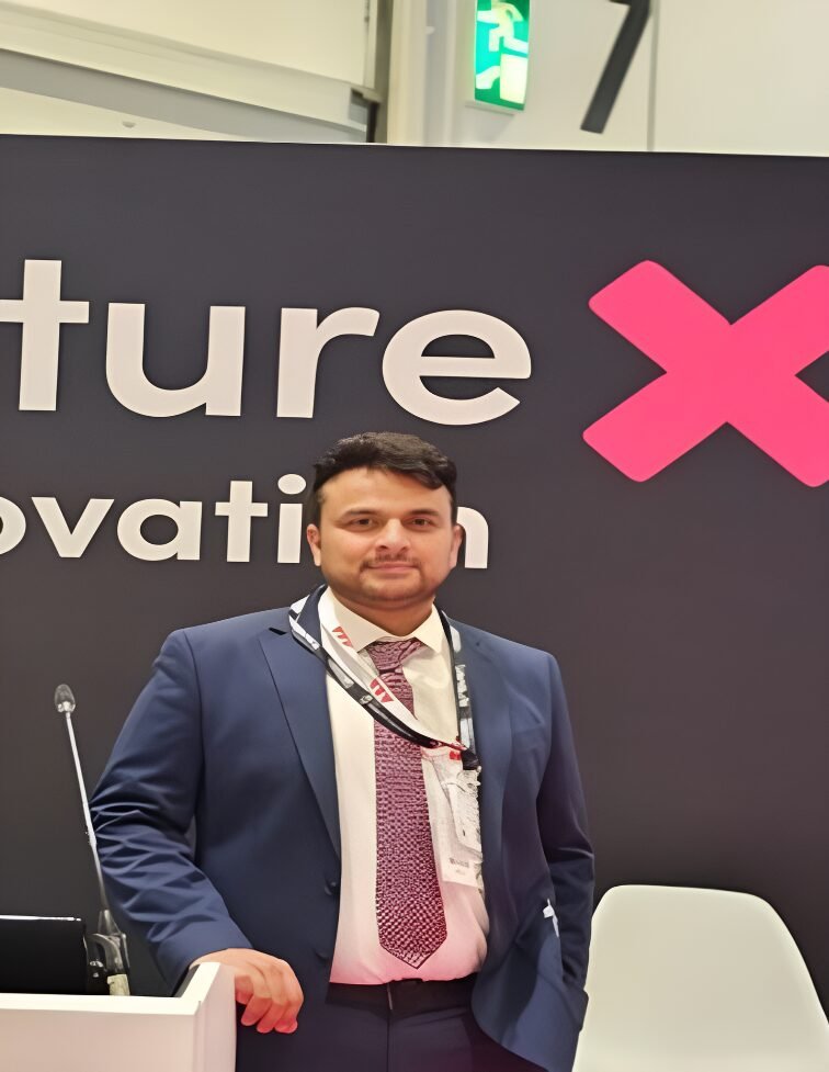Sultan Qureshi attending an innovation event in 2024, standing confidently in a professional setting.